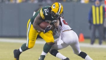 Dec 8, 2014; Green Bay, WI, USA; Green Bay Packers running back Eddie Lacy (27) rushes with the football during the first quarter against the Atlanta Falcons at Lambeau Field. Mandatory Credit: Jeff Hanisch-USA TODAY Sports
