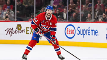 Apr 1, 2023; Montreal, Quebec, CAN; Montreal Canadiens defenseman Joel Edmundson (44) plays the puck against the Carolina Hurricanes during the first period at Bell Centre. Mandatory Credit: David Kirouac-USA TODAY Sports