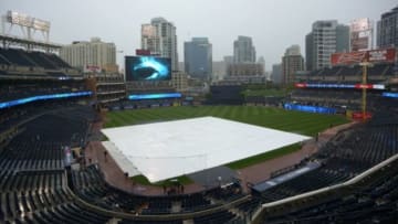 Jul 19, 2015; San Diego, CA, USA; The field at Petco Park is covered during a rain delay in the fifth inning between the Colorado Rockies and San Diego Padres. Mandatory Credit: Jake Roth-USA TODAY Sports