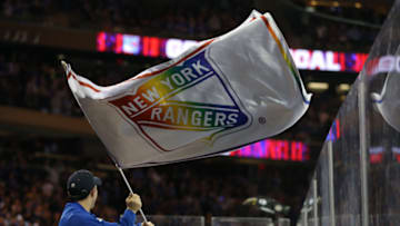 Mar 5, 2020; New York, New York, USA; New York Rangers fans and blue crew celebrate a goal against the Washington Capitals with rainbow flags for pride night during the second period at Madison Square Garden. Mandatory Credit: Brad Penner-USA TODAY Sports
