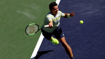 INDIAN WELLS, CA - MARCH 16: Milos Roanic of Canada lunges for a serve while playing Sam Querrey during quarterfinals of the BNP Paribas Open at the Indian Wells Tennis Garden on March 16, 2018 in Indian Wells, California. (Photo by Matthew Stockman/Getty Images)