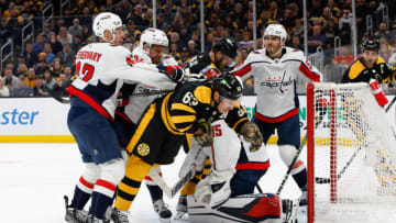 BOSTON, MA - FEBRUARY 11: Evgeny Kuznetsov #92 of the Washington Capitals crosschecks Brad Marchand #63 of the Boston Bruins during the first period at the TD Garden on February 11, 2023 in Boston, Massachusetts. (Photo by Richard T Gagnon/Getty Images)