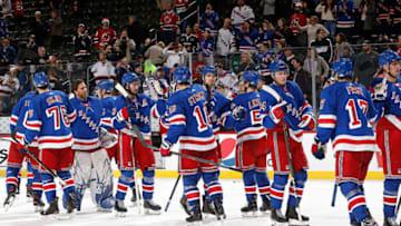 The New York Rangers react after defeating the New Jersey Devils