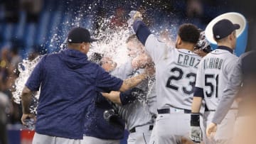 TORONTO, ON - MAY 8: James Paxton #65 of the Seattle Mariners is congratulated by teammates after throwing a no-hitter during MLB game action against the Toronto Blue Jays at Rogers Centre on May 8, 2018 in Toronto, Canada. (Photo by Tom Szczerbowski/Getty Images)