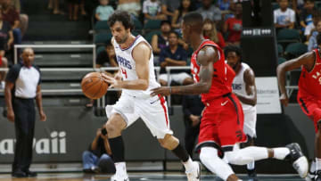 HONOLULU, HI - OCTOBER 1: Milos Teodosic #4 of the LA Clippers handles the ball during the preseason game against the Toronto Raptors on October 1, 2017 at the Stan Sheriff Center in Honolulu, HI. NOTE TO USER: User expressly acknowledges and agrees that, by downloading and or using this Photograph, user is consenting to the terms and conditions of the Getty Images License Agreement. Mandatory Copyright Notice: Copyright 2017 NBAE (Photo by Jay Metzger/NBAE via Getty Images)