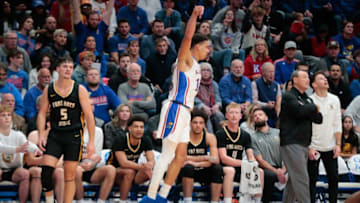 Kansas graduate senior guard Kevin McCullar Jr. (15) reacts after sinking a three during the first half of Wednesday's exhibition game against Fort Hays State inside Allen Fieldhouse.