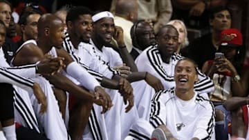 Oct 7, 2013; Miami, FL, USA; Miami Heat small forward Michael Beasley (floor) with shooting guard Ray Allen (from left to right) power forward Udonis Haslem, small forward LeBron James and shooting guard Dwyane Wade in the second half of a game against the Atlanta Hawks at American Airlines Arena. Mandatory Credit: Robert Mayer-USA TODAY Sports