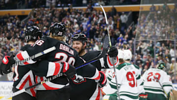 BUFFALO, NEW YORK - JANUARY 07: Rasmus Dahlin #26, Victor Olofsson #71, and Tyson Jost #17 of the Buffalo Sabres celebrate after a goal by Dahlin during the second period of an NHL hockey game against the Minnesota Wild at KeyBank Center on January 07, 2023 in Buffalo, New York. (Photo by Joshua Bessex/Getty Images)