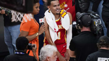 Apr 22, 2022; Atlanta, Georgia, USA; Atlanta Hawks guard Trae Young (11) reacts before being interviewed after the Hawks defeated the Miami Heat in game three of the first round for the 2022 NBA playoffs at State Farm Arena. Mandatory Credit: Dale Zanine-USA TODAY Sports