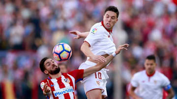 MADRID, SPAIN - MARCH 19: Yannick Carrasco (L) of Atletico de Madrid competes for the ball with Samir Nasri (R) of Sevilla FC during the La Liga match between Club Atletico de Madrid and Sevilla FC at Vicente Calderon stadium on March 19, 2017 in Madrid, Spain. (Photo by Gonzalo Arroyo Moreno/Getty Images)