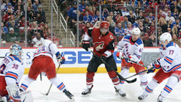 GLENDALE, AZ - JANUARY 06: Brendan Perlini #11 of the Arizona Coyotes tries to get control of the puck in front of goalie Henrik Lundqvist #30 of the New York Rangers as he is surrounded by Marc Staal #18, Brendan Smith #42 and Jesper Fast #17 of the Rangers during the second period at Gila River Arena on January 6, 2018 in Glendale, Arizona. (Photo by Norm Hall/NHLI via Getty Images)