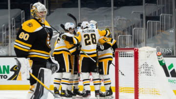 Apr 1, 2021; Boston, Massachusetts, USA; Pittsburgh Penguins defenseman Marcus Pettrsson (28) celebrates with teammates after Zach Aston-Reese (12) scored a goal against the Boston Bruins in the second period at TD Garden. Mandatory Credit: Kathryn Riley-USA TODAY Sports
