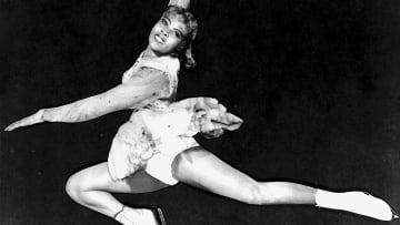 Mabel Fairbanks performs a figure skating move.