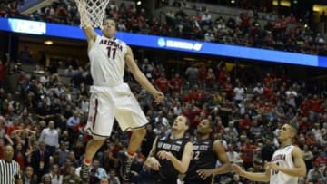 Mar 27, 2014; Anaheim, CA, USA; Arizona Wildcats forward Aaron Gordon (11) dunks the ball past San Diego State Aztecs forward Matt Shrigley (40) during the second half in the semifinals of the west regional of the 2014 NCAA Mens Basketball Championship tournament at Honda Center. Mandatory Credit: Richard Mackson-USA TODAY Sports