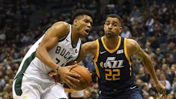 MILWAUKEE, WI - DECEMBER 09: Giannis Antetokounmpo #34 of the Milwaukee Bucks drives to the basket against Thabo Sefolosha #22 of the Utah Jazz during a game at the Bradley Center on December 9, 2017 in Milwaukee, Wisconsin. NOTE TO USER: User expressly acknowledges and agrees that, by downloading and or using this photograph, User is consenting to the terms and conditions of the Getty Images License Agreement. (Photo by Stacy Revere/Getty Images)