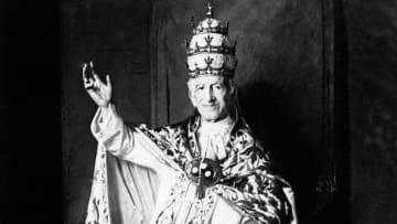 Cocaine wine enthusiast Pope Leo XIII waves to the camera.