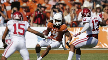 Oct 10, 2015; Dallas, TX, USA; Texas Longhorns receiver Marcus Johnson (7) runs with the ball against Oklahoma Sooners cornerback Zack Sanchez (15) and safety Ahmad Thomas (13) during Red River rivalry at Cotton Bowl Stadium. Mandatory Credit: Matthew Emmons-USA TODAY Sports