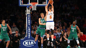Dec 7, 2015; New York, NY, USA; New York Knicks forward Kristaps Porzingis (6) shoots over Dallas Mavericks forward Dirk Nowitzki (41) during the first quarter at Madison Square Garden. Mandatory Credit: Anthony Gruppuso-USA TODAY Sports