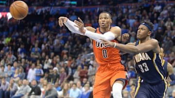 Nov 20, 2016; Oklahoma City, OK, USA; Oklahoma City Thunder guard Russell Westbrook (0) passes the ball while guarded by Indiana Pacers center Myles Turner (33) during the fourth quarter at Chesapeake Energy Arena. Mandatory Credit: Mark D. Smith-USA TODAY Sports