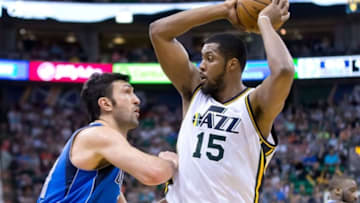Apr 11, 2016; Salt Lake City, UT, USA; Dallas Mavericks center Zaza Pachulia (27) defends against Utah Jazz forward Derrick Favors (15) during the second half at Vivint Smart Home Arena. Dallas won 101-92. Mandatory Credit: Russ Isabella-USA TODAY Sports