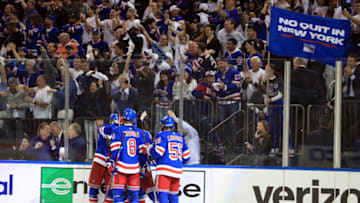 May 22, 2022; New York, New York, USA; New York Rangers center Tyler Motte (64) celebrates his empty-net goal against the Carolina Hurricanes during the third period in game three of the second round of the 2022 Stanley Cup Playoffs at Madison Square Garden. Mandatory Credit: Danny Wild-USA TODAY Sports