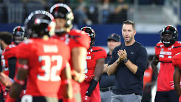 ARLINGTON, TX - NOVEMBER 25: Head coach Kliff Kingsbury of the Texas Tech Red Raiders watch his team during warm ups before the game between the Texas Tech Red Raiders and the Baylor Bears on November 25, 2016 at AT