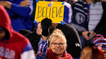 Nov 27, 2021; Lawrence, Kansas, USA; A Kansas Jayhawks fan holds a sign during the first half against the West Virginia Mountaineers at David Booth Kansas Memorial Stadium. Mandatory Credit: Jay Biggerstaff-USA TODAY Sports