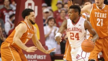 Feb 8, 2016; Norman, OK, USA; Oklahoma Sooners guard Buddy Hield (24) dribbles the ball as Texas Longhorns guard Javan Felix (3) defends during the first half at Lloyd Noble Center. Mandatory Credit: Mark D. Smith-USA TODAY Sports