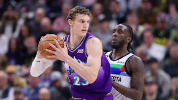 Feb 8, 2023; Salt Lake City, Utah, USA; Utah Jazz forward Lauri Markkanen (23) posts up against Minnesota Timberwolves forward Taurean Prince (12) in the first half at Vivint Arena. Mandatory Credit: Rob Gray-USA TODAY Sports