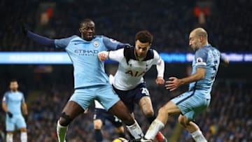 MANCHESTER, ENGLAND - JANUARY 21: Yaya Toure of Manchester City (L) nd Pablo Zabaleta of Manchester City (R) tackle Dele Alli of Tottenham Hotspur (C) during the a Premier League match between Manchester City and Tottenham Hotspur at the Etihad Stadium on January 21, 2017 in Manchester, England. (Photo by Clive Mason/Getty Images)