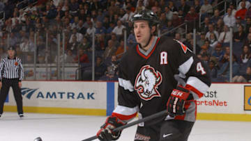 WASHINGTON, DC - NOVEMBER 28: Rhett Warrener #4 of the Buffalo Sabres looks on during a NHL hockey game against the Washington Capitals at MCI Center on November 28, 2001 in Washington, DC. (Photo by Mitchell Layton/Getty Images)