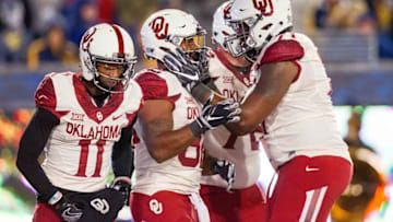 Nov 19, 2016; Morgantown, WV, USA; Oklahoma Sooners running back Samaje Perine (32) celebrates with teammates after scoring a touchdown during the second quarter against the West Virginia Mountaineers at Milan Puskar Stadium. Mandatory Credit: Ben Queen-USA TODAY Sports