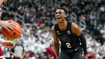 Michigan State's Tyson Walker, right, celebrates his 3-pointer against Indiana during the second half on Saturday, Feb. 12, 2022, at the Breslin Center in East Lansing.220212 Msu Indiana Bball 192a