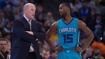 January 4, 2016; Oakland, CA, USA; Charlotte Hornets head coach Steve Clifford (left) instructs guard Kemba Walker (15) during the third quarter against the Golden State Warriors at Oracle Arena. The Warriors defeated the Hornets 111-101. Mandatory Credit: Kyle Terada-USA TODAY Sports