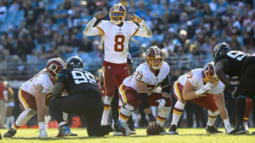 JACKSONVILLE, FL - DECEMBER 16: Josh Johnson #8 of the Washington Redskins signals before the snap during the second half against the Jacksonville Jaguars at TIAA Bank Field on December 16, 2018 in Jacksonville, Florida. (Photo by Sam Greenwood/Getty Images)