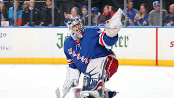 NEW YORK, NY - DECEMBER 09: Henrik Lundqvist #30 of the New York Rangers tends the net during pregame warmups before the game against the New Jersey Devils at Madison Square Garden on December 9, 2017 in New York City. (Photo by Jared Silber/NHLI via Getty Images)
