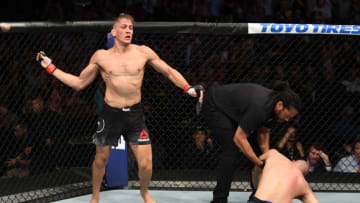 TAMPA, FLORIDA - OCTOBER 12: (L-R) Niko Price celebrates his KO victory over James Vick in their welterweight bout during the UFC Fight Night event at Amalie Arena on October 12, 2019 in Tampa, Florida. (Photo by Josh Hedges/Zuffa LLC via Getty Images)