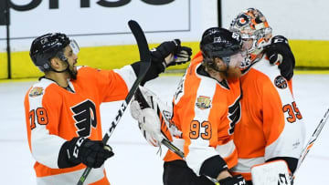 Nov 29, 2016; Philadelphia, PA, USA; Philadelphia Flyers goalie Steve Mason (35) celebrates with center Chris VandeVelde (76) and right wing Jakub Voracek (93) after making final save during the shootout period at Wells Fargo Center. The Flyers defeated the Bruins, 3-2 in a shootout. Mandatory Credit: Eric Hartline-USA TODAY Sports