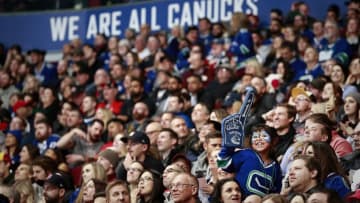 VANCOUVER, BC - FEBRUARY 9: A Vancouver Canuck fan cheers during their NHL game against the Calgary Flames at Rogers Arena February 9, 2019 in Vancouver, British Columbia, Canada. (Photo by Jeff Vinnick/NHLI via Getty Images)"n