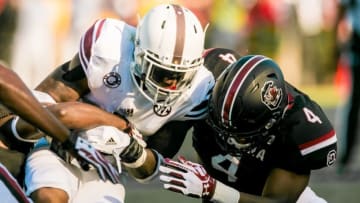Oct 1, 2016; Columbia, SC, USA; Texas A&M Aggies running back Trayveon Williams (5) is brought down by South Carolina Gamecocks linebacker Bryson Allen-Williams (4) at Williams-Brice Stadium. Mandatory Credit: Jeff Blake-USA TODAY Sports
