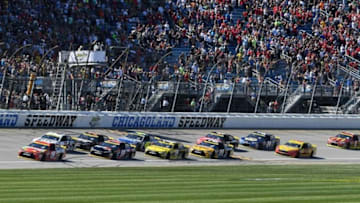 Sep 18, 2016; Joliet, IL, USA; Sprint Cup Series driver Kyle Busch (18) leads the field to the green flag during the Teenage Mutant Ninja Turtles 400 at Chicagoland Speedway. Mandatory Credit: Mike DiNovo-USA TODAY Sports