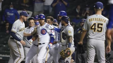 CHICAGO, ILLINOIS - APRIL 06: Willson Contreras #40 of the Chicago Cubs stares down Brad Boxberger #45 of the Milwaukee Brewers after he was hit by a pitch during the ninth inning of a game at Wrigley Field on April 06, 2021 in Chicago, Illinois. (Photo by Nuccio DiNuzzo/Getty Images)