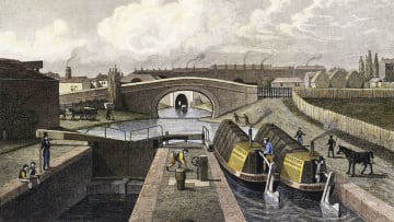 Frederick James Havell's painting, "The Double Lock and East Entrance to the Islington Tunnel, Regent's Canal" (1827), shows two horse-drawn canal boats passing through the lock, approaching the tunnel. Construction of the Regent's Canal began in 1812.