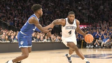 NEW YORK, NY - MARCH 16: Eric Paschall #4 of the Villanova Wildcats dribbles around Myles Cale #22 of the Seton Hall Pirates during the Big East Men's Basketball Championship at Madison Square Garden on March 16, 2019 in New York City. (Photo by Mitchell Layton/Getty Images)