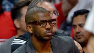 Apr 27, 2016; Los Angeles, CA, USA; Los Angeles Clippers guard Chris Paul (3) sits on the bench with his arm in a cast during the first quarter of game five of the first round of the NBA Playoffs against the Portland Trail Blazers at Staples Center. Mandatory Credit: Jayne Kamin-Oncea-USA TODAY Sports