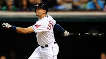 Sep 14, 2015; Cleveland, OH, USA; Cleveland Indians right fielder Lonnie Chisenhall (8) hits a sacrifice fly during the fifth inning against the Kansas City Royals at Progressive Field. Mandatory Credit: Ken Blaze-USA TODAY Sports