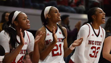 RALEIGH, NC - JANUARY 05: North Carolina State Wolfpack forward/center Nae Nae Cole (44), North Carolina State Wolfpack forward DD Rogers (21) and North Carolina State Wolfpack center Akela Maize (32) cheer on their teammates after a second half run during the game between the Miami Hurricanes and the North Carolina State Wolfpack on January 5, 2016 at Reynolds Coliseum in Raleigh, NC. Miami defeated NC State 67-64. (Photo by William Howard/Icon Sportswire via Getty Images)