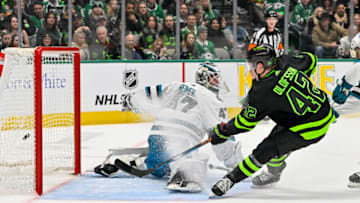 Dec 31, 2022; Dallas, Texas, USA; Dallas Stars left wing Fredrik Olofsson (42) scores his first career NHL goal against San Jose Sharks goaltender James Reimer (47) during the second period at the American Airlines Center. Mandatory Credit: Jerome Miron-USA TODAY Sports