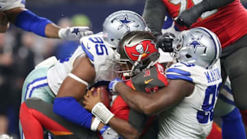 Dec 18, 2016; Arlington, TX, USA; Tampa Bay Buccaneers quarterback Jameis Winston (3) is sacked in the fourth quarter by Dallas Cowboys defensive end Benson Mayowa (93) and David Irving (95) at AT&T Stadium. Dallas beat Tampa 26-20. Mandatory Credit: Matthew Emmons-USA TODAY Sports