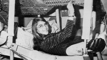 Margaret Hamilton, lead Apollo flight software engineer, in the Apollo Command Module.